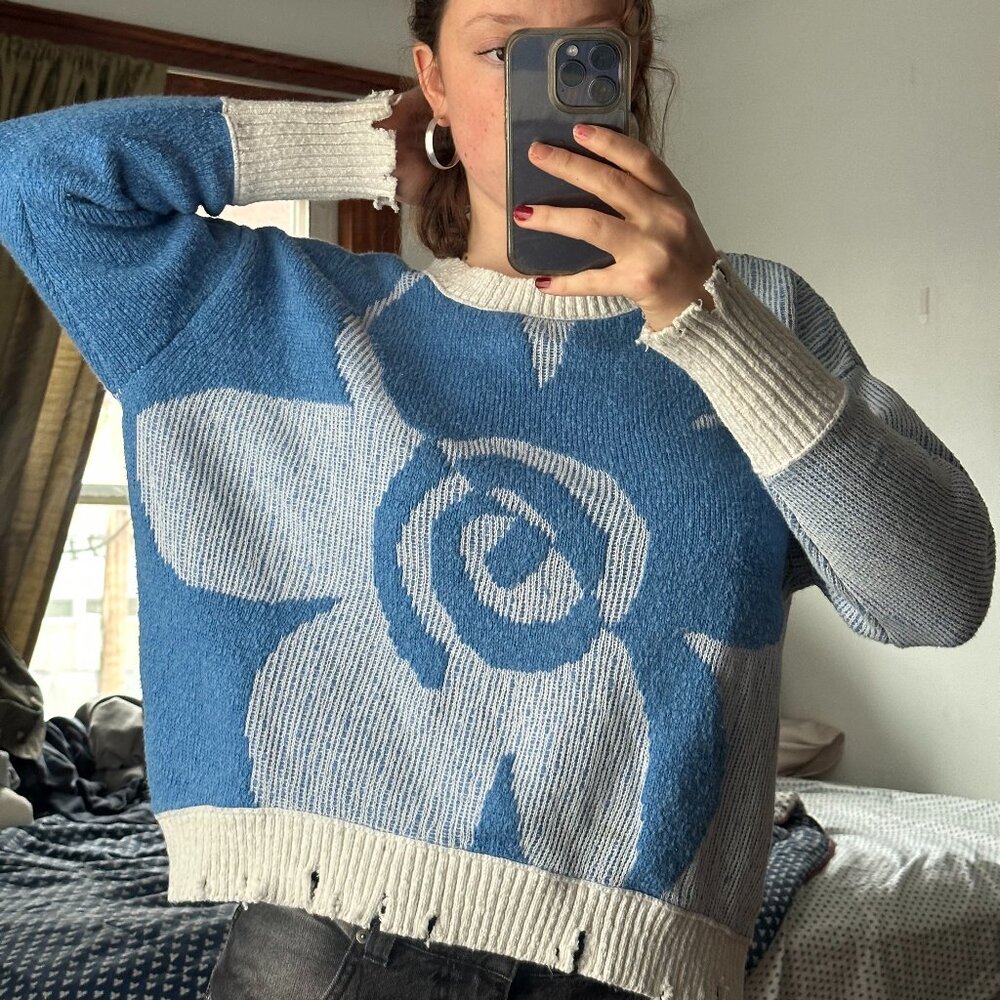 Distressed graphic sweater